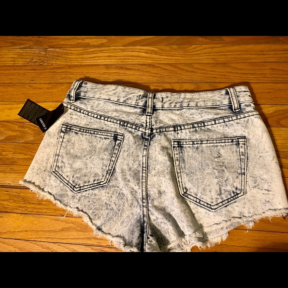 New with tags, high waisted light wash jean shorts. - Picture 3 of 10